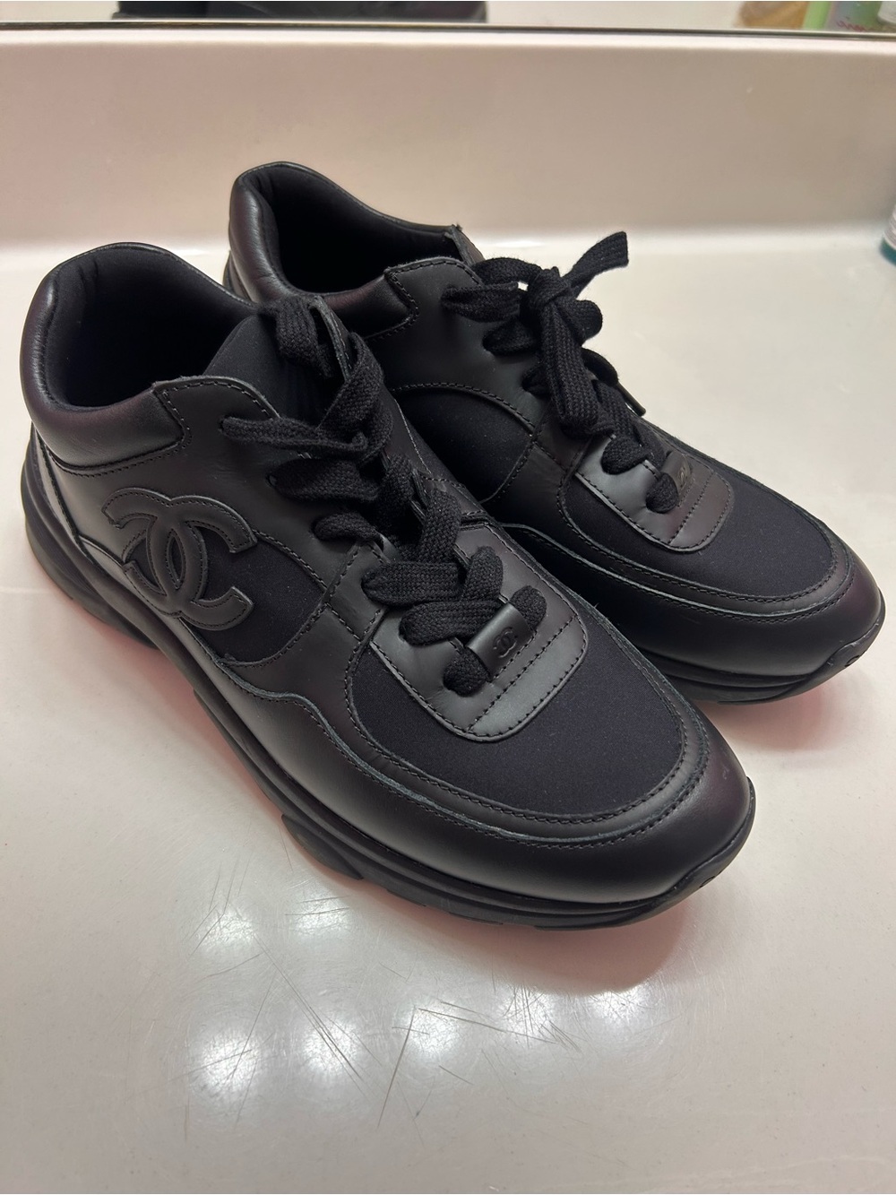 CHANEL All-Black Leather & Neoprene Low-Top Sneakers